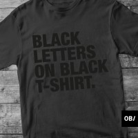 Black letters on black t-shirt